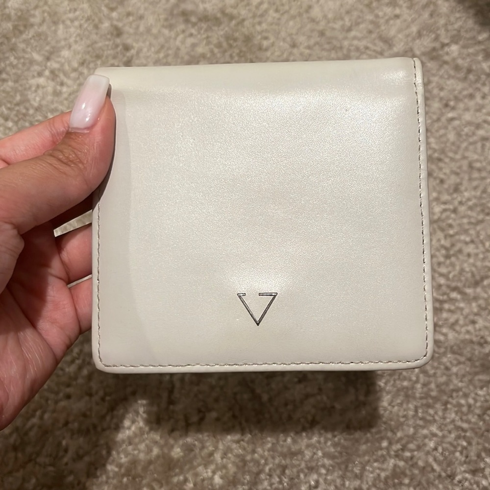white and pink wallet